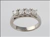 Platinum, claw set, 4 stone diamond ring
