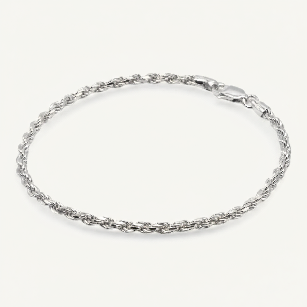 Silver rope chain bracelet on a white background