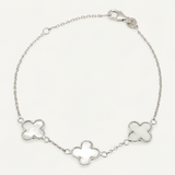 Silver bracelet with clover-shaped links on a white background