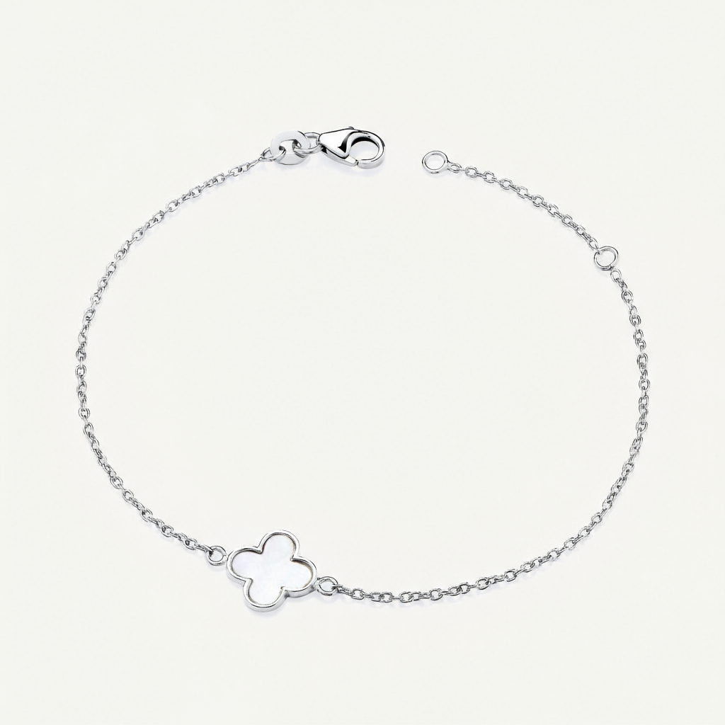 Silver clover bracelet on a light grey background