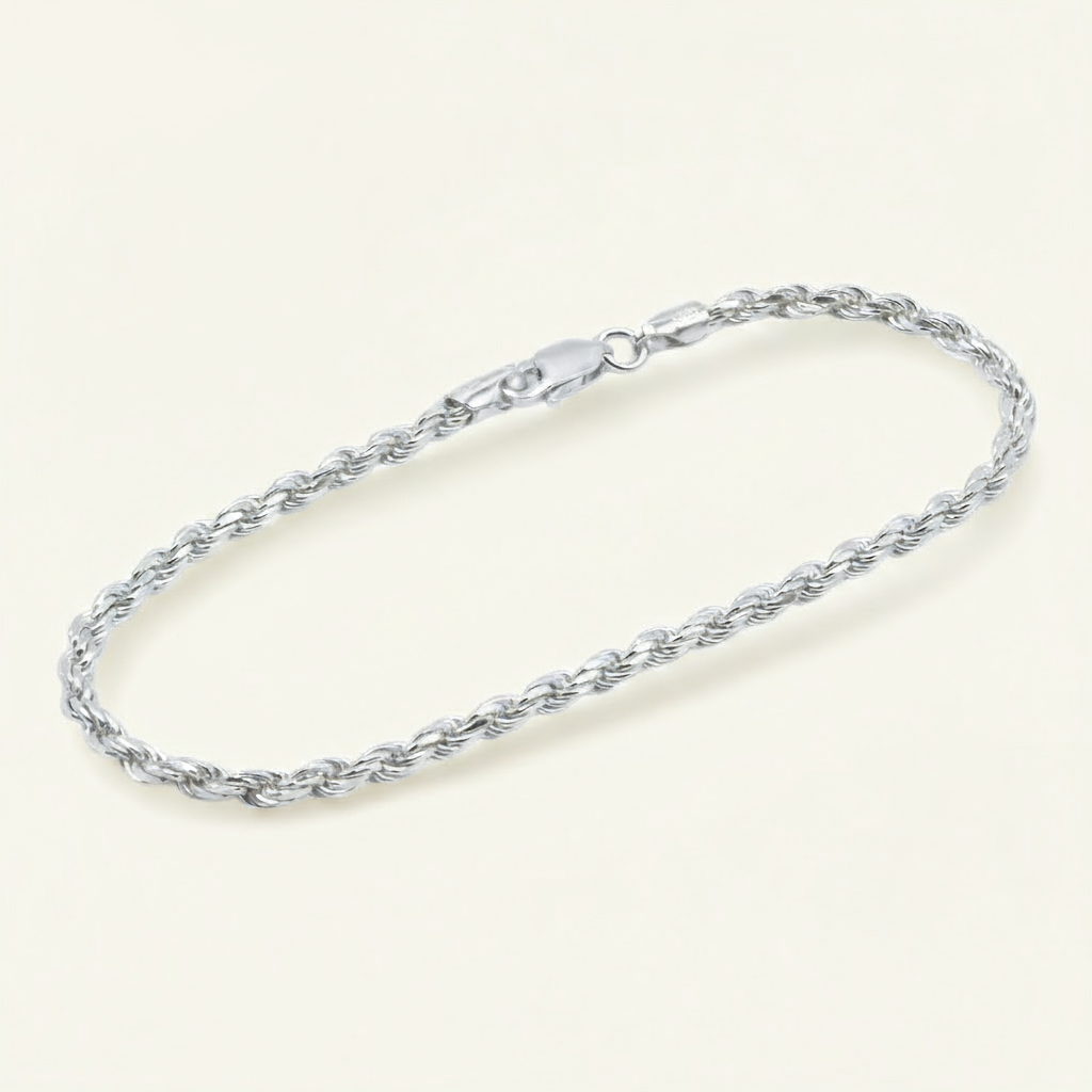 silver rope bracelet on a beige background